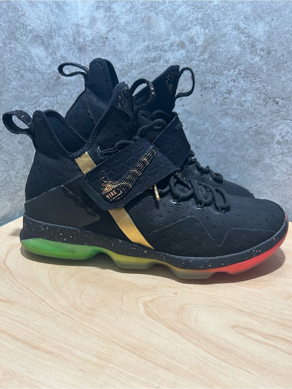Nike LeBron 14 sneakers in black with gold accents and a rainbow sole Men’s 11